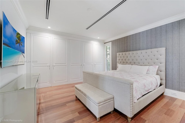 4550 Sunset Dr, Coral Gables, FL 33143 - bedroom with ornamental molding, light wood-style flooring, a closet, and recessed lighting
