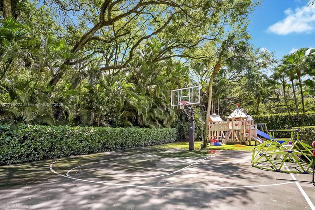 4550 Sunset Dr, Coral Gables, FL 33143 - view of basketball court featuring a playground and basketball hoop