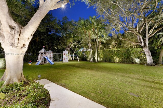 4550 Sunset Dr, Coral Gables, FL 33143 - view of green lawn with a playground