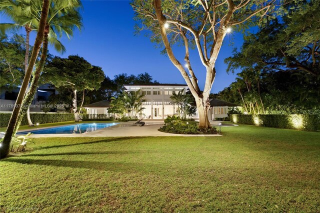 4550 Sunset Dr, Coral Gables, FL 33143 - view of green lawn with a patio area