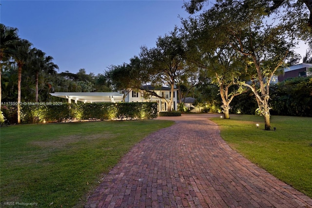 4550 Sunset Dr, Coral Gables, FL 33143 - view of front of property with decorative driveway and a front yard