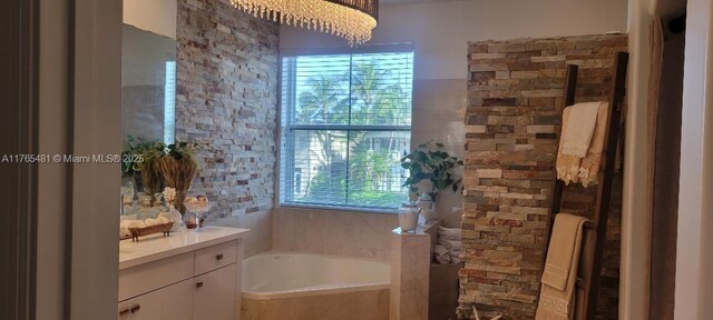 949 Harbor Vw N, Hollywood, FL 33019 - bathroom with tiled shower, a bath, and vanity