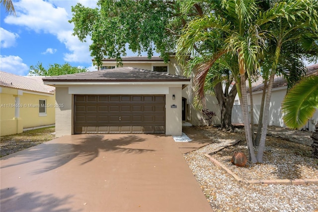view of front of home with stucco siding and driveway