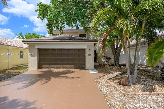 19852 NW 88th Ave, Hialeah, FL 33018 - view of front of home with stucco siding and concrete driveway