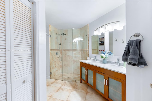 full bath featuring a shower stall, a closet, and a sink