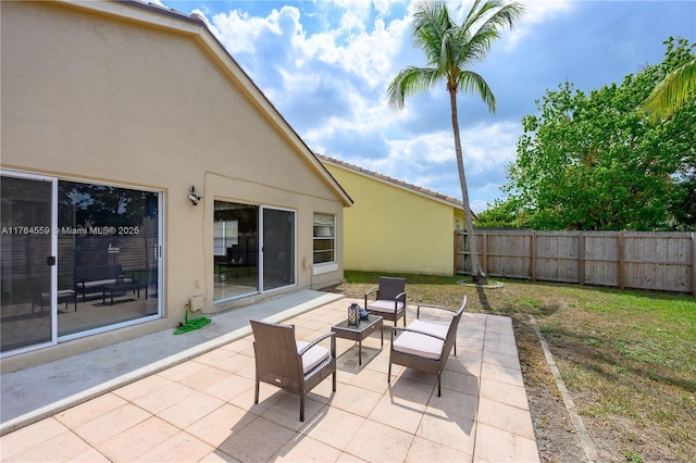 view of patio / terrace featuring fence