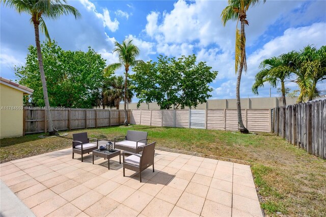 19852 NW 88th Ave, Hialeah, FL 33018 - fenced backyard featuring a patio area