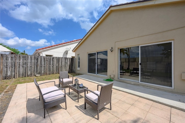 view of patio / terrace with outdoor lounge area and a fenced backyard