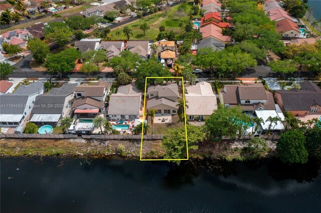 19852 NW 88th Ave, Hialeah, FL 33018 - aerial view of residential area with property parcel outlined and a large body of water