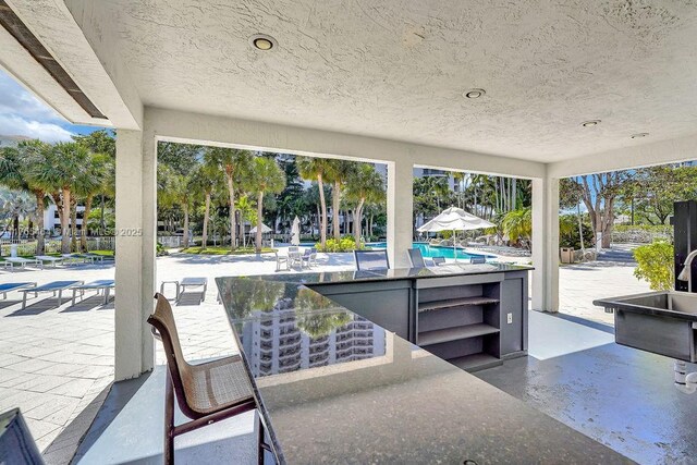 3300 NE 191st St Unit Lp03, Aventura, FL 33180 - view of patio / terrace featuring a community pool