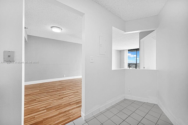 3300 NE 191st St Unit Lp03, Aventura, FL 33180 - unfurnished room featuring a textured ceiling, baseboards, and tile patterned flooring