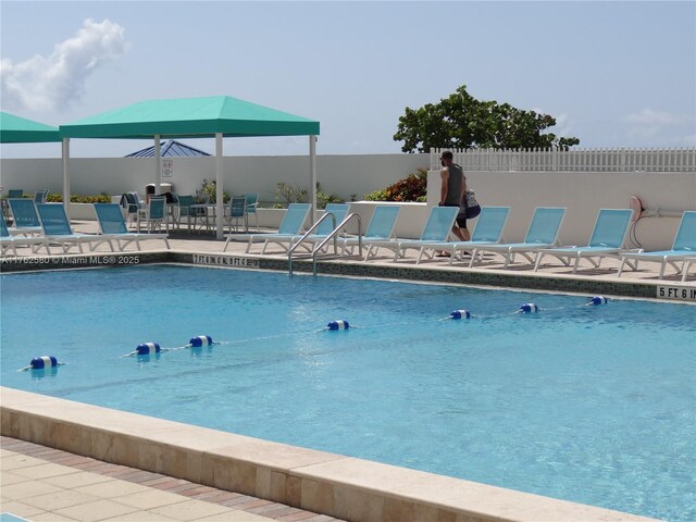 3725 S Ocean Dr Unit 607, Hollywood, FL 33019 - community pool featuring a patio