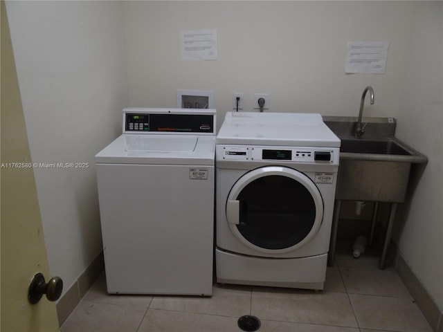 3725 S Ocean Dr Unit 607, Hollywood, FL 33019 - community laundry room with washer and clothes dryer, light tile patterned flooring, and baseboards