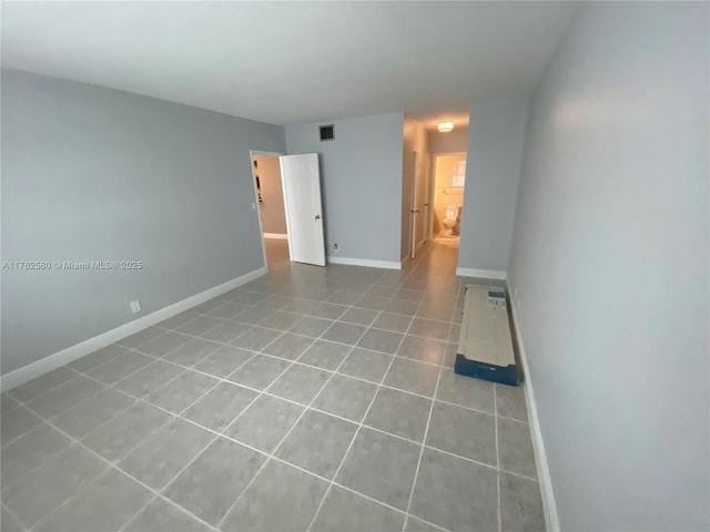 3725 S Ocean Dr Unit 607, Hollywood, FL 33019 - tiled empty room featuring baseboards