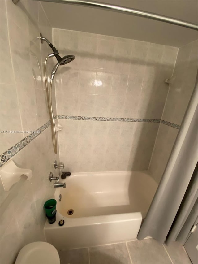 3725 S Ocean Dr Unit 607, Hollywood, FL 33019 - full bathroom with shower / washtub combination, tile patterned flooring, toilet, and tile walls