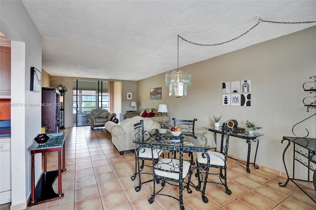 2811 Somerset Dr Unit 405, Lauderdale Lakes, FL 33311 - dining room with a notable chandelier, light tile patterned flooring, and a textured ceiling