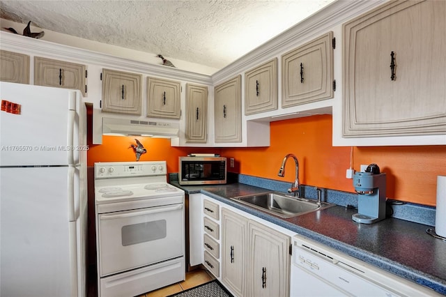 2811 Somerset Dr Unit 405, Lauderdale Lakes, FL 33311 - kitchen with dark countertops, under cabinet range hood, white appliances, a textured ceiling, and a sink