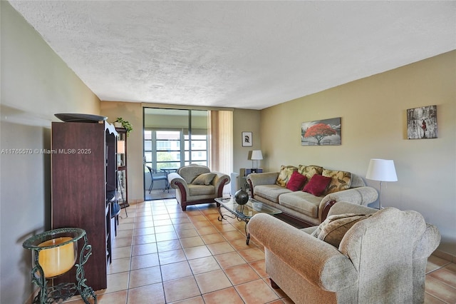 2811 Somerset Dr Unit 405, Lauderdale Lakes, FL 33311 - living room featuring light tile patterned floors and a textured ceiling