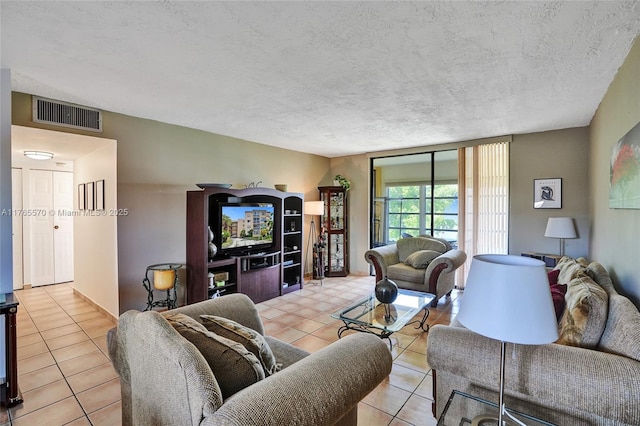 2811 Somerset Dr Unit 405, Lauderdale Lakes, FL 33311 - living area with tile patterned floors, visible vents, and a textured ceiling
