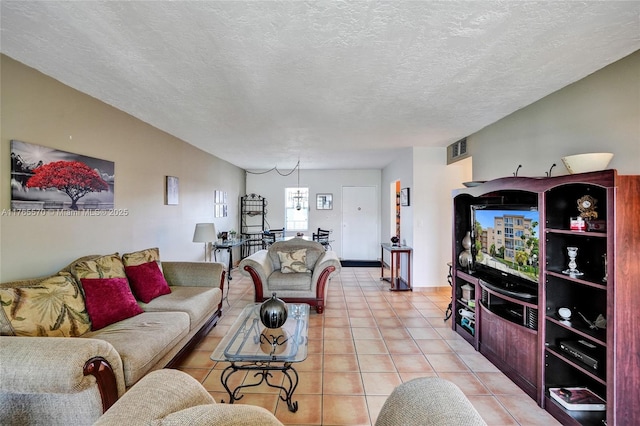 2811 Somerset Dr Unit 405, Lauderdale Lakes, FL 33311 - living area featuring light tile patterned floors, visible vents, and a textured ceiling