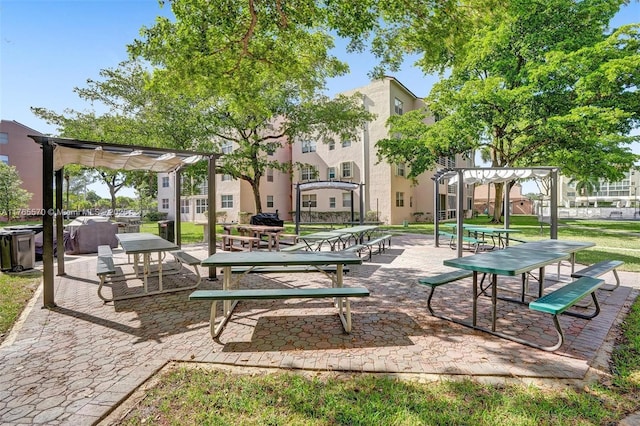 2811 Somerset Dr Unit 405, Lauderdale Lakes, FL 33311 - view of property's community featuring a lawn and a pergola