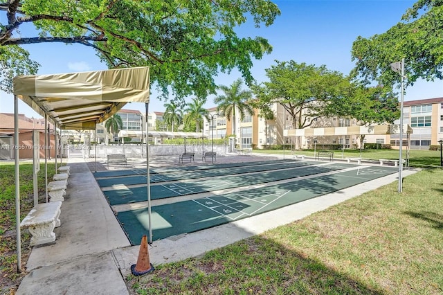 2811 Somerset Dr Unit 405, Lauderdale Lakes, FL 33311 - view of home's community featuring a residential view, a lawn, and shuffleboard