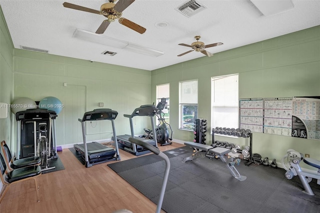 2811 Somerset Dr Unit 405, Lauderdale Lakes, FL 33311 - gym with visible vents, wood finished floors, and a ceiling fan