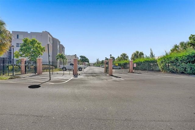 2811 Somerset Dr Unit 405, Lauderdale Lakes, FL 33311 - view of road featuring sidewalks, a gated entry, and a gate
