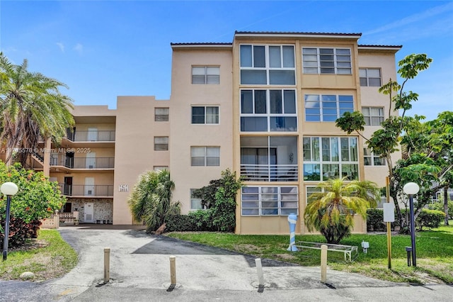 2811 Somerset Dr Unit 405, Lauderdale Lakes, FL 33311 - view of building exterior with driveway