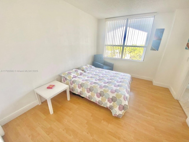 9801 Collins Ave Unit 8M, Bal Harbour, FL 33154 - bedroom featuring light wood-type flooring