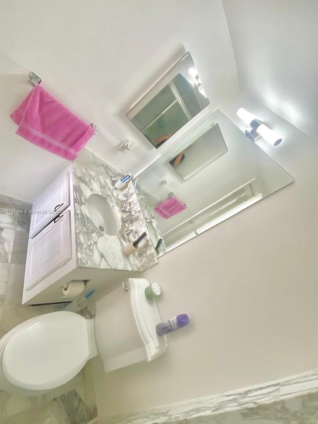 9801 Collins Ave Unit 8M, Bal Harbour, FL 33154 - bathroom featuring toilet
