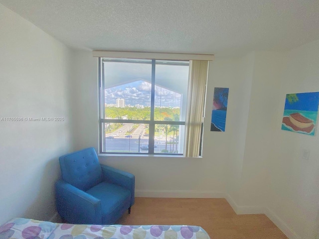 9801 Collins Ave Unit 8M, Bal Harbour, FL 33154 - bedroom featuring a textured ceiling