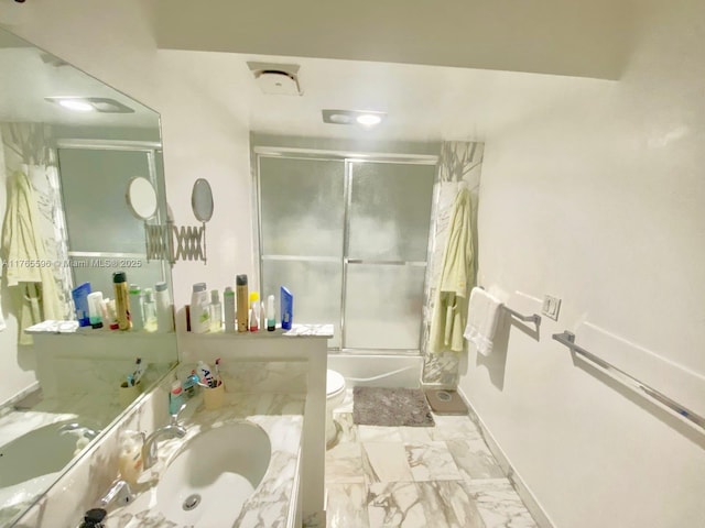 9801 Collins Ave Unit 8M, Bal Harbour, FL 33154 - full bathroom with vanity, marble look tiles, and combined bath / shower with glass door
