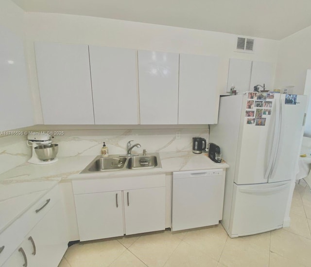 9801 Collins Ave Unit 8M, Bal Harbour, FL 33154 - kitchen featuring white appliances, white cabinetry, and light tile patterned floors