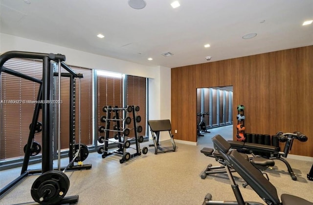 1300 S Miami Ave Unit 3108, Miami, FL 33130 - workout room with visible vents, wooden walls, recessed lighting, and baseboards