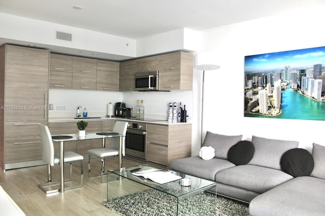 1300 S Miami Ave Unit 3108, Miami, FL 33130 - living area featuring visible vents and light wood-type flooring