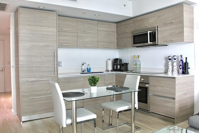 1300 S Miami Ave Unit 3108, Miami, FL 33130 - kitchen featuring a sink, stainless steel appliances, modern cabinets, and light countertops