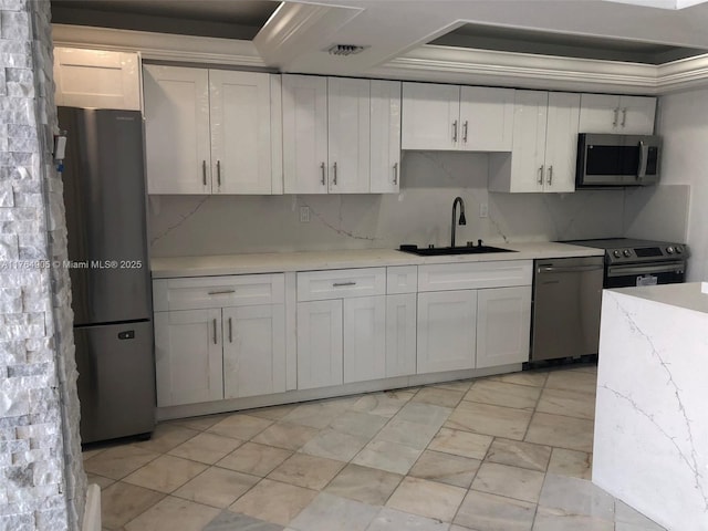 18041 Biscayne Blvd Unit Ph02, Aventura, FL 33160 - kitchen featuring white cabinetry, ornamental molding, a sink, visible vents, and appliances with stainless steel finishes