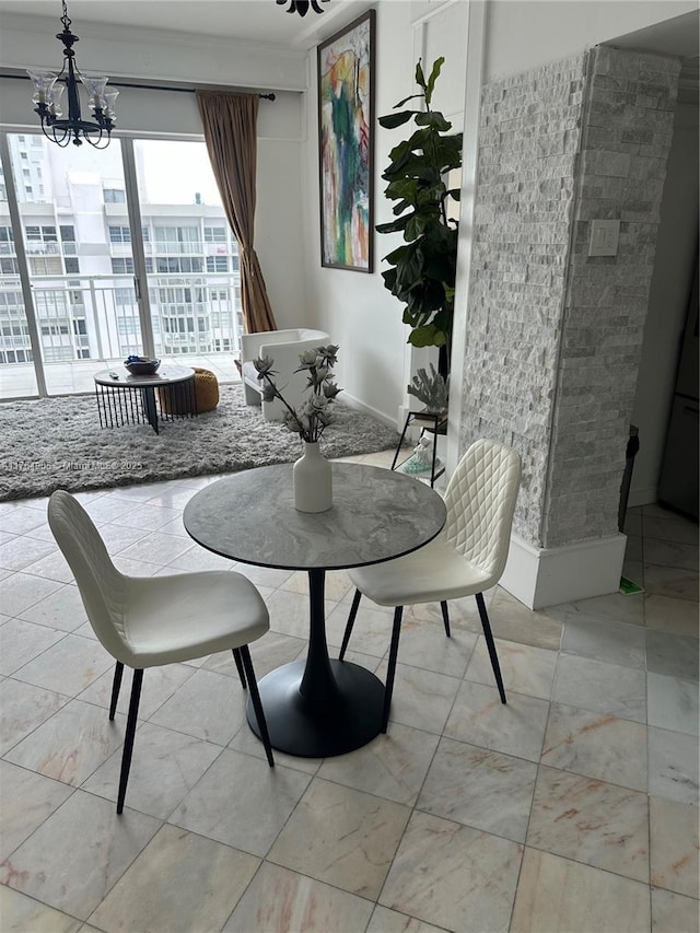 18041 Biscayne Blvd Unit Ph02, Aventura, FL 33160 - dining area with baseboards and an inviting chandelier