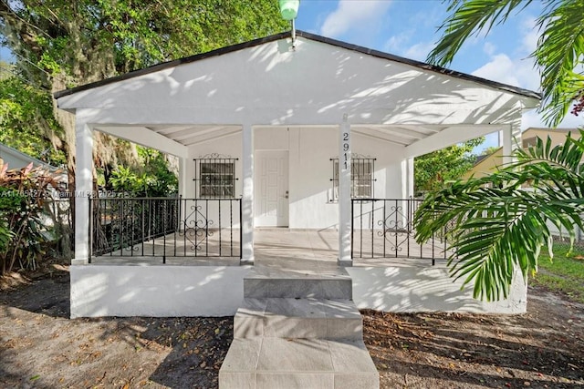 2911 NW 30th St, Miami, FL 33142 - entrance to property with a porch