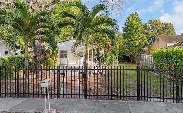 2911 NW 30th St, Miami, FL 33142 - view of gate featuring a fenced front yard