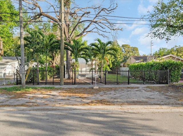 2911 NW 30th St, Miami, FL 33142 - view of gate featuring a fenced front yard
