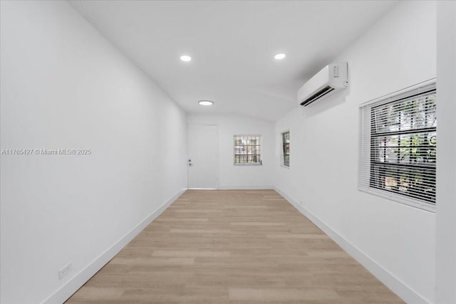2911 NW 30th St, Miami, FL 33142 - hallway featuring light wood-style flooring, recessed lighting, baseboards, and a wall mounted air conditioner