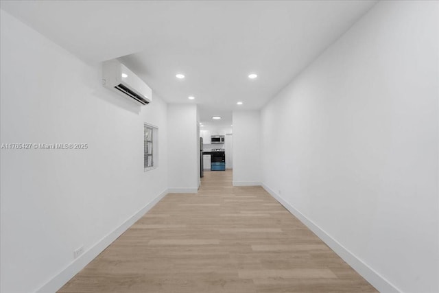 2911 NW 30th St, Miami, FL 33142 - hall featuring recessed lighting, baseboards, light wood-type flooring, and a wall mounted AC