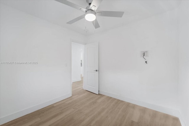 2911 NW 30th St, Miami, FL 33142 - empty room featuring wood finished floors, baseboards, and ceiling fan