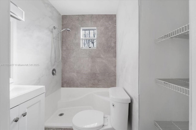 2911 NW 30th St, Miami, FL 33142 - bathroom with vanity, toilet, and a shower stall