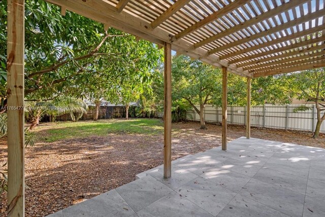 2911 NW 30th St, Miami, FL 33142 - view of patio with a pergola and a fenced backyard