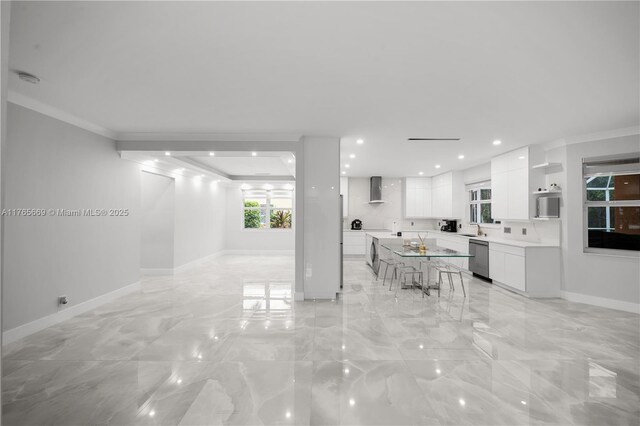 living area featuring recessed lighting, baseboards, marble finish floor, and crown molding