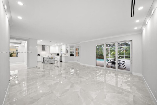 unfurnished living room with visible vents, baseboards, ornamental molding, recessed lighting, and marble finish floor