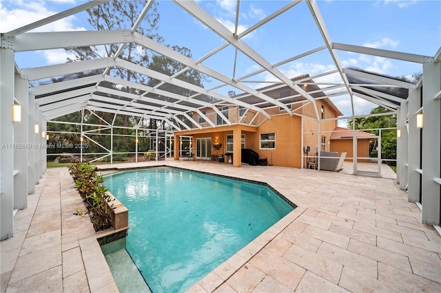 pool featuring a lanai and a patio